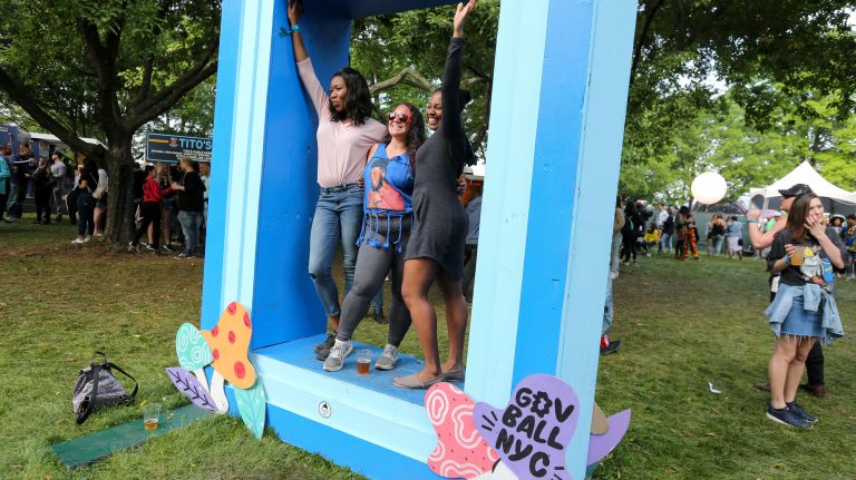 Visitors pose for a picture in the 21 and older area on Sunday at the Governors Ball on Randall's Island.