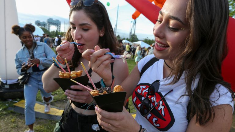 Lindsey Toia, left, and Scarlett Ball have ice cream from 