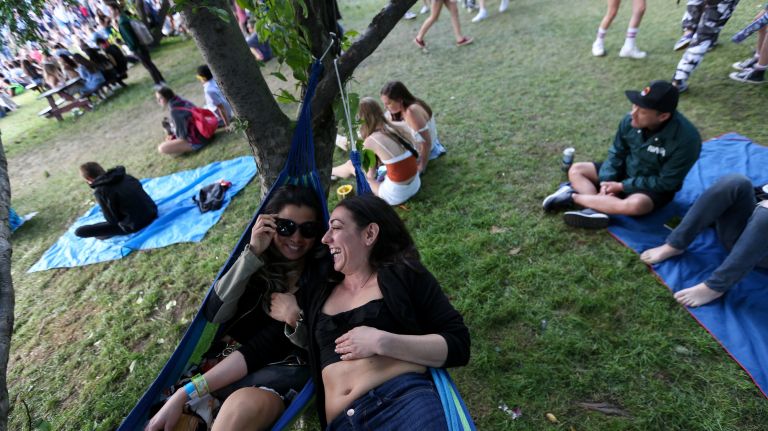 Stephanie Koh, left, and Melissa Fears, of Astoria, lay in their hammock Sunday at the Governors Ball on Randall's Island.