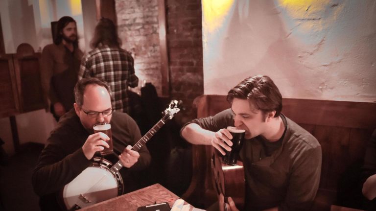 Dan Neely, left and Matt Stapleton sip a Guinness between sets at Hartley's on Putnam Avenue in Brooklyn. 