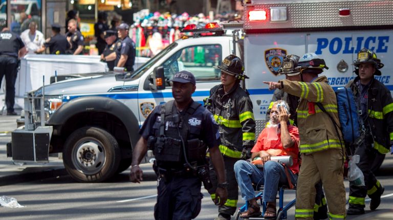 A pedestrian is taken to an emergency vehicle after being part of a crowd that was struck by a car in Times Square on May 18, 2017.