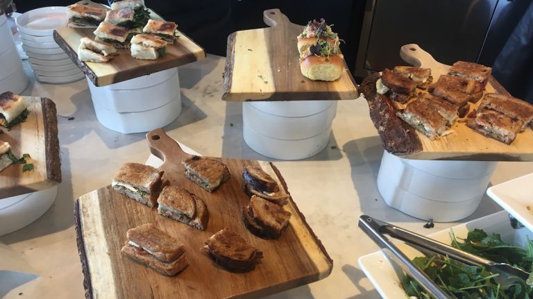 Kitchen 21's The Café offers pressed and cold sandwiches for those looking to grab something quick before heading back to the beach. Two varieties of grilled cheese -- the classic with American, and a French twist featuring brie cheese, apples, alfalfa and truffle honey -- are on the menu.