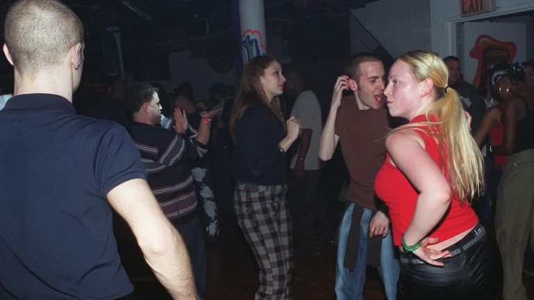 Plenty a Friday night was spent dancing the night away at Manhattan's Club Shelter on West 39th Street. Pictured, a group parties at the graffiti-covered club on March 16, 2002. 