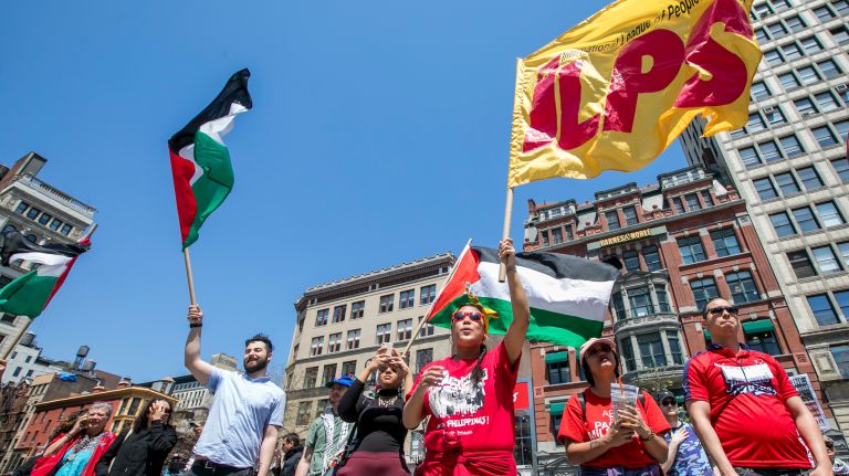 May Day protests: Photos of the NYC demonstrations 7 May Madarang, of Queens, attends the May Day rally at Union Square in Manhattan on Tuesday, May 1, 2018.