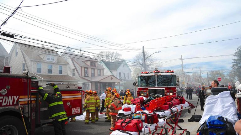 FDNY firefighters work at a house fire at 112th Avenue and 208th Street in Queens Village on Sunday, April 23, 2017. Thirty-nine units and 168 personnel fought Sunday's blaze before it was declared under control at 4:25 p.m., officials said.