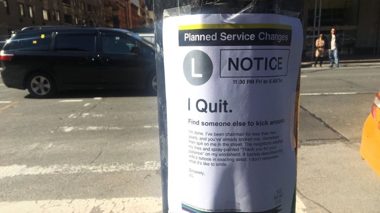 A fake poster with a resignation from Joseph Lhota is taped to a streetlight outside the 14th Street/Eighth Avenue subway station in Manhattan on Tuesday, Feb. 27, 2018.