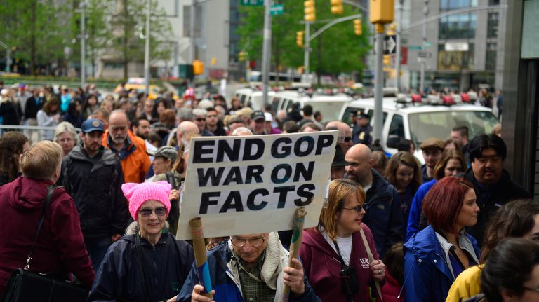 March for Science in NYC: Photos of the Earth Day rally against Trump 27 A demonstrator holds a protest sign Saturday, April 22, 2017, during the March for Science in Manhattan.