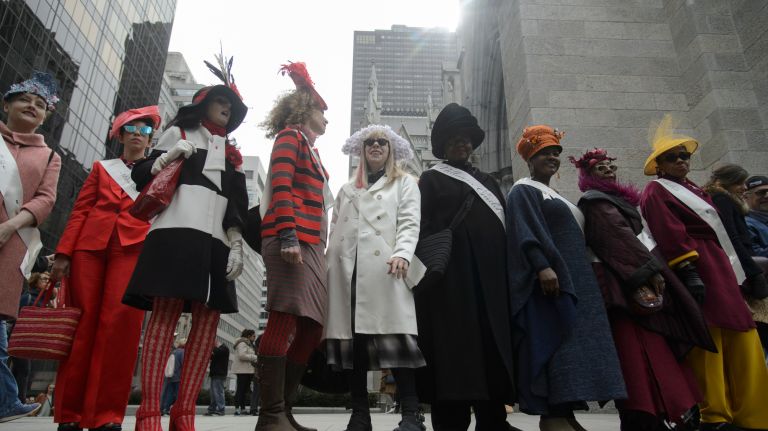 People gather on the step of St. Patrick's Cathedral during the Easter parade and bonnet festival.