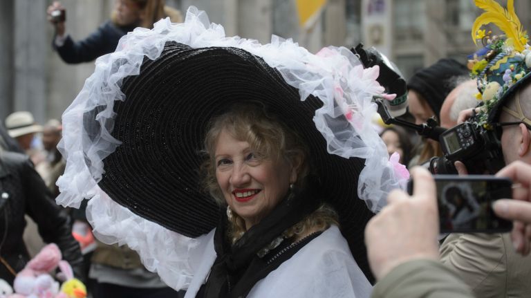 A woman shows off her very large Easter Bonnet.
