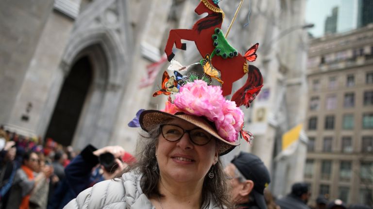 People with spider web hats gather on Fifth Avenue for the Easter parade and bonnet festival.