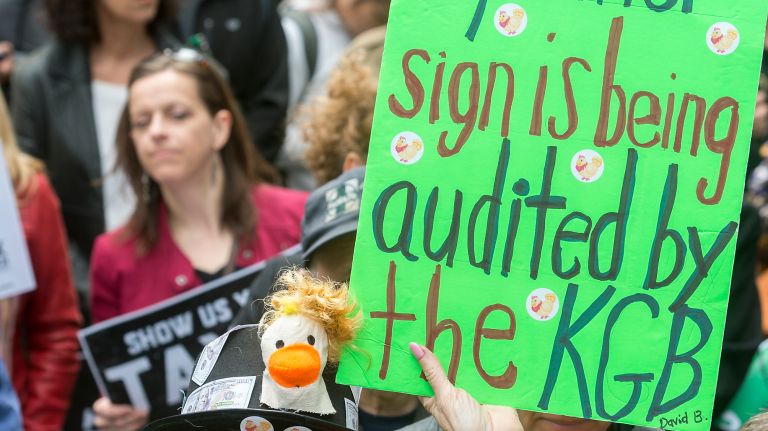 Protesters rally at Bryant Park on Saturday, April 15, 2017, calling on President Donald Trump to disclose his taxes.
