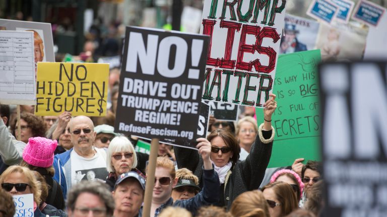Protesters at Bryant Park rally against President Donald Trump's decision to not release his tax returns on Saturday, April 15, 2017.