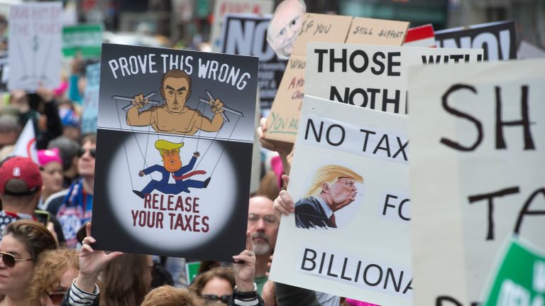 Protesters rally at Bryant Park during the Tax March on Saturday, April 15, 2017. Demonstrators called on President Donald Trump to share his tax returns.