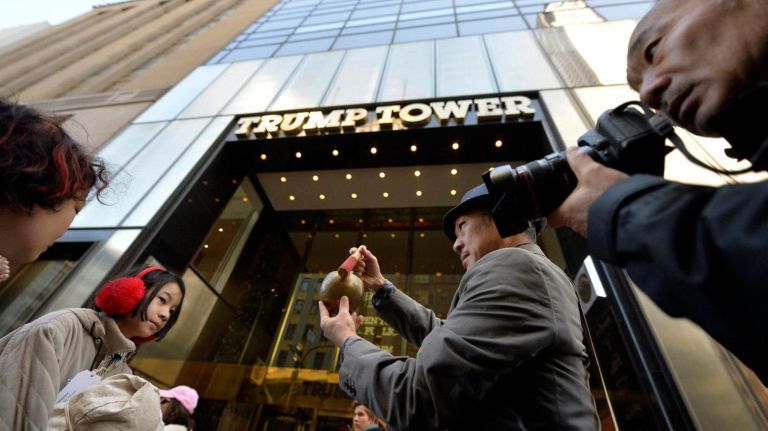 Perry Yung (52) rings a Buddhist bell in front of Trump Tower in Manhattan during a Silent Peace March on Saturday, Feb. 18, 2017. 75 years ago, President Franklin D. Roosevelt signed executive order 9066 in 1942, which authorized the U.S. military to remove 120,000 people of Japanese descent, from their homes on the west coast to inland concentration camps. Most were U.S. citizens at the time of their internment. To commemorate the day and to show solidarity with Muslim Americans who fear being banned from the U.S., dozens of people walked to the Japanese American Church on 7th Ave. where they were met by internment survivors.