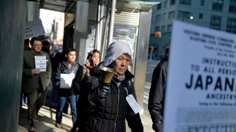 Shigeko Suga (57) from Brooklyn rings a bell during a Silent Peace March in Manhattan on Feb. 18, 2017. About two dozen people marched from Columbus Circle to the Japanese American Church on 7th Ave. to commemorate the Japanese Americans who were held in concentration camps on U.S. soil 75 years ago after President Franklin D. Roosevelt signed executive order 9066 in 1942. The executive order authorized the U.S. military to remove 120,000 people of Japanese descent from their homes on the west coast to inland concentration camps. Most were U.S. citizens at the time of their internment. To commemorate the day and to show solidarity with Muslim Americans who fear being banned from the U.S., dozens of people walked to the Japanese American Church during a Day of Remembrance silent march.