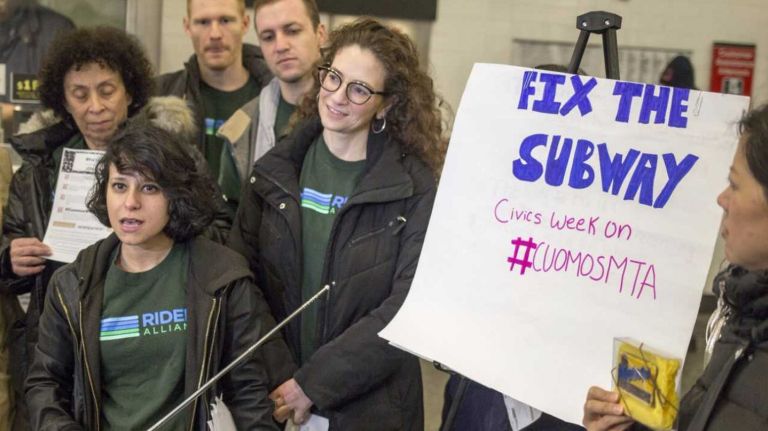 Rebecca Bailin, left, campaign manager at Riders Alliance, announces the launch of a week-long 