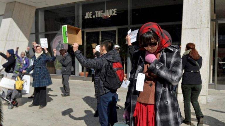 Sonnie Brown (52) and actress from Astoria and about two dozen others pause in front of the W.R. Grace building in Manhattan during a Silent Peace March on Saturday, Feb. 18, 2017. 75 years ago, President Franklin D. Roosevelt signed executive order 9066 in 1942, which authorized the U.S. military to remove 120,000 people of Japanese descent, from their homes on the west coast to inland concentration camps. Most were U.S. citizens at the time of their internment. To commemorate the day and to show solidarity with Muslim Americans who fear being banned from the U.S., dozens of people marched from Columbus Circle to the Japanese American Church where they were met by internment survivors.