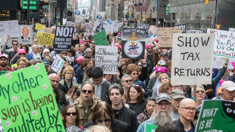 Demonstrators march from Bryant Park to Trump Tower on Fifth Avenue, calling for the president to release his tax returns on April 15, 2017.