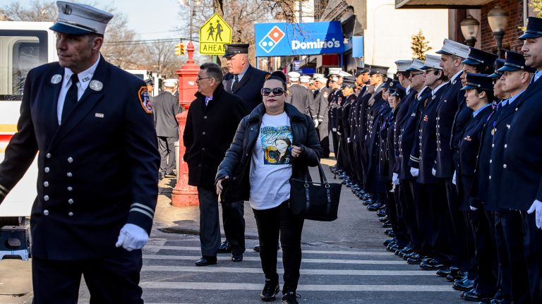 A family member wearing a T-shirt printed with the words 