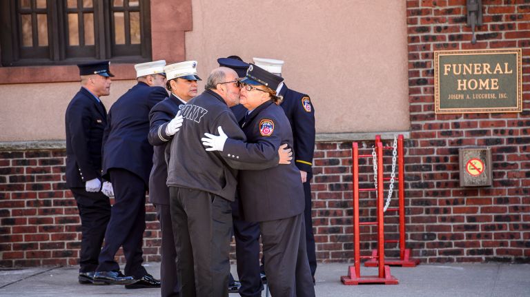 Mourners embrace as they arrive for the wake for Yadira Arroyo at the Joseph A. Lucchese Funeral Home on Morris Park Avenue in the Bronx, Thursday, March 23, 2017.