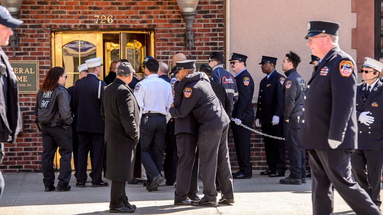 Mourners embrace as they arrive for the wake for Yadira Arroyo at the Joseph A. Lucchese Funeral Home on Morris Park Avenue in the Bronx, Thursday, March 23, 2017.