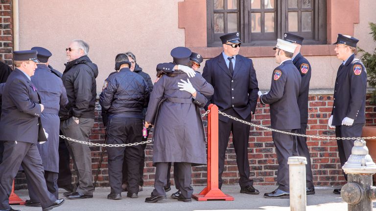 Mourners embrace as they arrive for the wake for Yadira Arroyo at the Joseph A. Lucchese Funeral Home on Morris Park Avenue in the Bronx, Thursday, March 23, 2017.
