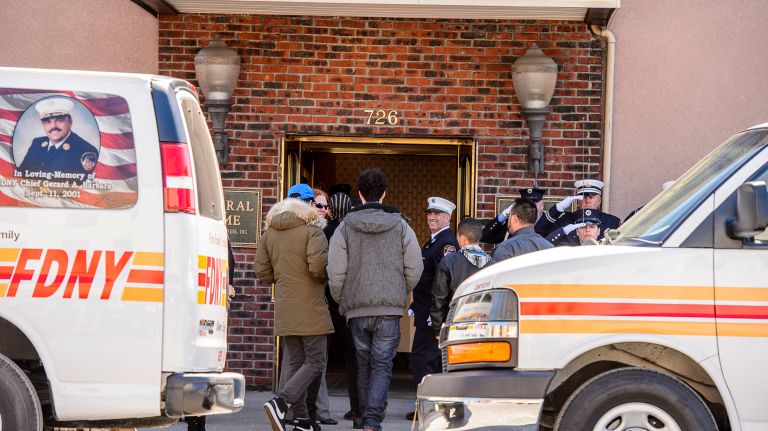 FDNY members line up to honor family members arriving at the wake for Yadira Arroyo in the Joseph A. Lucchese Funeral Home on Morris Park Avenue in the Bronx, Thursday, March 23, 2017.