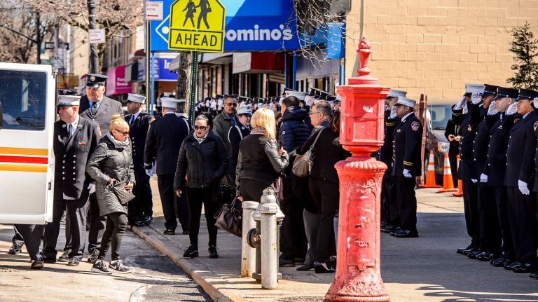 FDNY members line up to honor family members arriving at the wake for Yadira Arroyo in the Joseph A. Lucchese Funeral Home on Morris Park Avenue in the Bronx, Thursday, March 23, 2017.