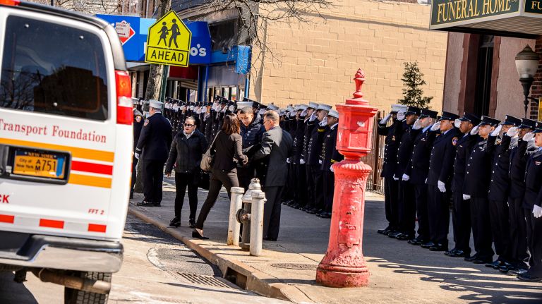 FDNY members line up to honor family members arriving at the wake for Yadira Arroyo in the Joseph A. Lucchese Funeral Home on Morris Park Avenue in the Bronx, Thursday, March 23, 2017.