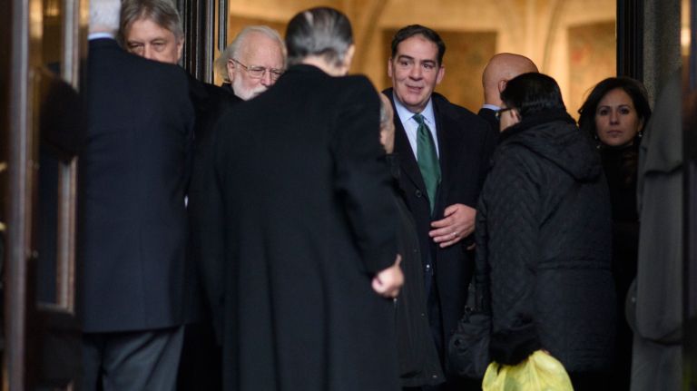 Patrick Breslin, center, the son of Pulitzer Prize-winning columnist Jimmy Breslin, exits his father's funeral Mass at the Church of the Blessed Sacrament in Manhattan on Wednesday, March 22, 2017. 