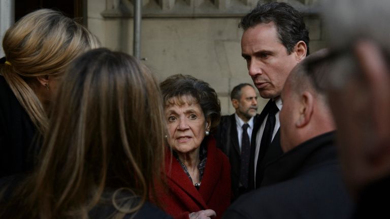 Matilda Cuomo, center, and her son Chris, leave the Church of the Blessed Sacrament in Manhattan after a funeral Mass for Pulitzer Prize-winning columnist Jimmy Breslin on Wednesday, March 22, 2017. 