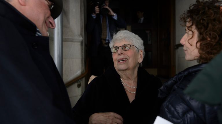 Ronnie Eldridge, center, the widow of Pulitzer Prize-winning columnist Jimmy Breslin, arrives for her husband's funeral Mass at the Church of the Blessed Sacrament in Manhattan on Wednesday, March 22, 2017. 