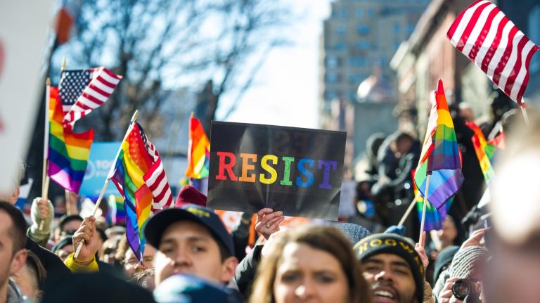 People protest at a rally in front of the Stonewall Inn in solidarity with immigrants, asylum seekers, refugees and the LGBT community on Saturday, Feb. 4, 2017, in Manhattan. 