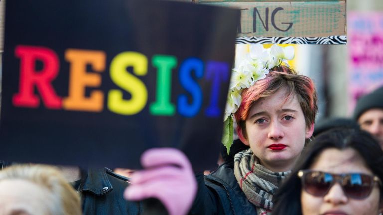 People protest at a rally in front of the Stonewall Inn in solidarity with immigrants, asylum seekers, refugees and the LGBT community on Saturday, Feb. 4, 2017, in Manhattan. 
