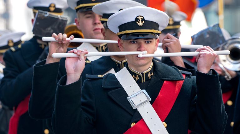 A drummer with the U.S. Merchant Marine Academy pauses while marching along Fifth Avenue during the New York City St. Patrick's Day Parade Friday, March 17, 2017, in Manhattan.