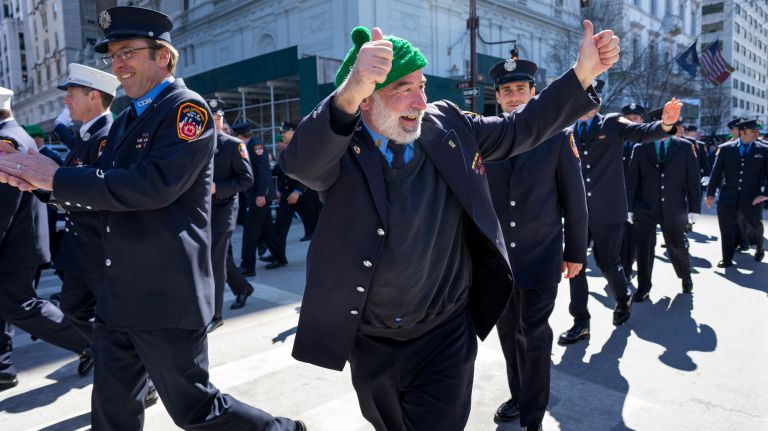 FDNY members get the crowd fired up as they march during the New York City St. Patrick's Day Parade Friday, March 17, 2017, in Manhattan.