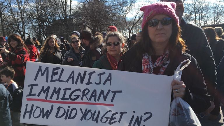 A woman holds a sign at a rally in Battery Park on Jan. 29, 2017, protesting President Donald Trump's immigration travel ban. 