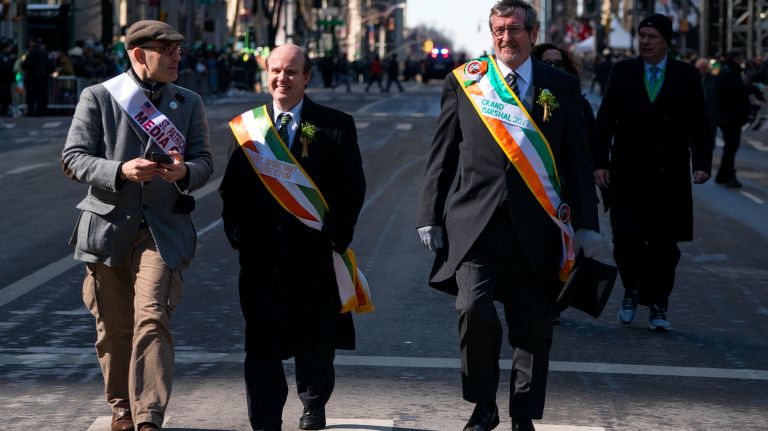 At right, Grand Marshal Michael J. Dowling, president and chief executive of Northwell Health, gets ready before the St. Patrick's Day Parade on Fifth Avenue in Manhattan Friday, March 17, 2017.