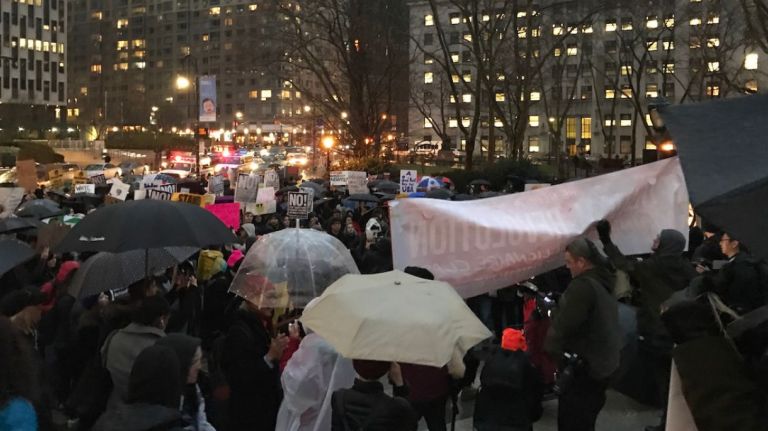 Rain didn't stop the crowds that gathered downtown from continuing to demonstrate against Trump, chanting slogans like 