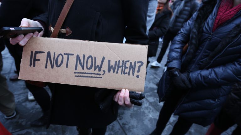 A participant displays a sign at the International Women's Strike and rally in Washington Square Park, coinciding with International Women's Day, Thursday, Mar. 8, 2018.