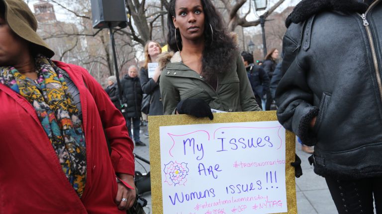A woman holds a sign during the International Women's Strike and rally in Washington Square Park, coinciding with International Women's Day, on Thursday, Mar. 8, 2018.