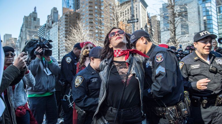 A protester is arrested in Manhattan's Columbus Circle during the A Day Without a Woman rally on International Women's Day on March 8, 2017.