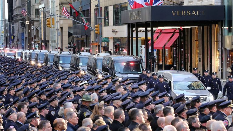 The funeral procession for NYPD Det. Steven McDonald makes its way down Fifth Avenue toward St. Patrick's Cathedral on Friday, Jan. 13, 2017.