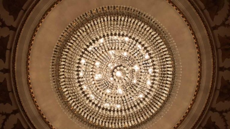 In the famous two-story main ballroom in the Waldorf Astoria, there's a massive chandelier setting the scene for the fabulous weddings, parties and charitable events that take place there.