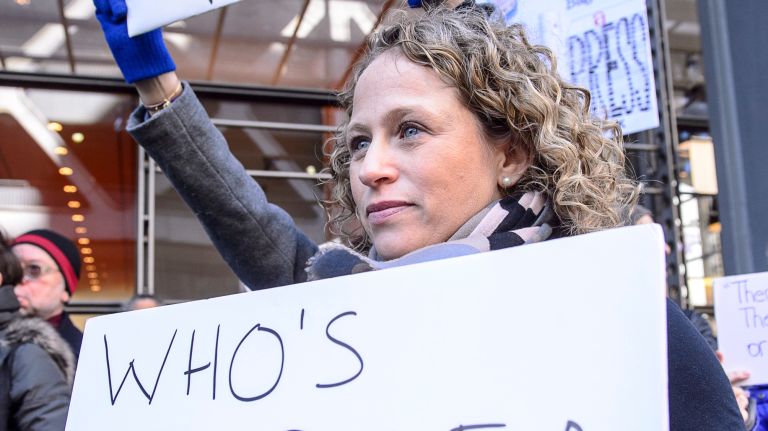 A protester shows support for the press outside the New York Times building in midtown Manhattan during the March for a Free Press on Feb. 26, 2017.