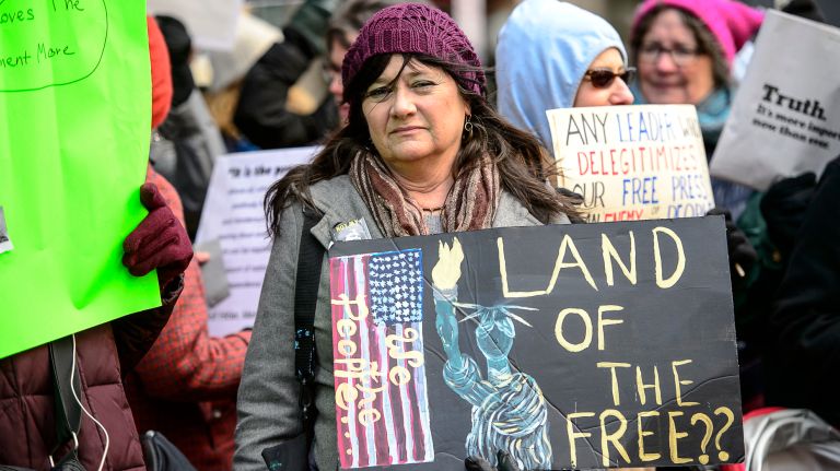 A protester joins the rally outside the New York Times building in midtown Manhattan during the March for a Free Press on Feb. 26, 2017.