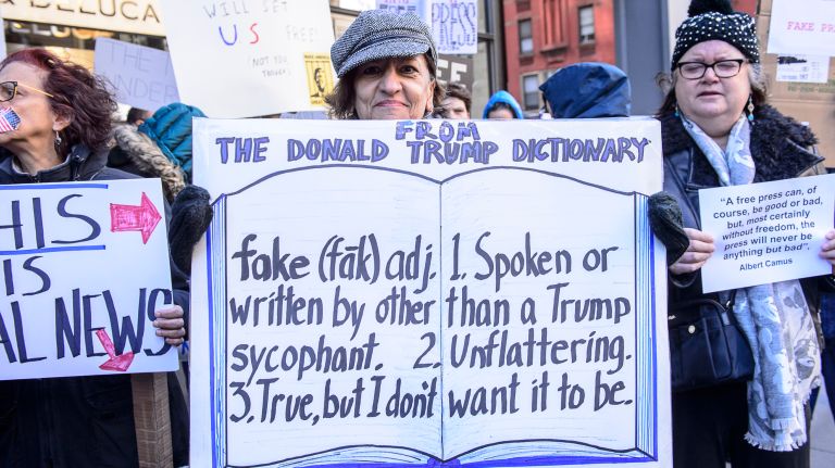 A protester joins the rally outside the New York Times building in midtown Manhattan during the March for a Free Press on Feb. 26, 2017.
