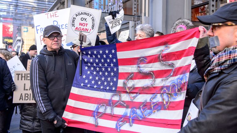 Protesters rally outside the New York Times building in midtown Manhattan during the March for a Free Press on Feb. 26, 2017.