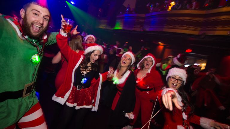 Costumed revelers get their jolly on at Webster Hall in Manhattan during SantaCon on Saturday, Dec. 10, 2016.