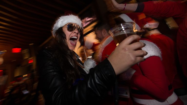 SantaCon costumed revelers celebrate at the Ainsworth Park bar on East 18th Street in Manhattan, on Saturday, Dec. 10, 2016.